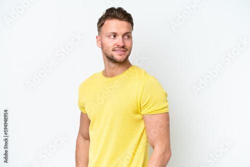 Young blonde caucasian man isolated on white background . Portrait