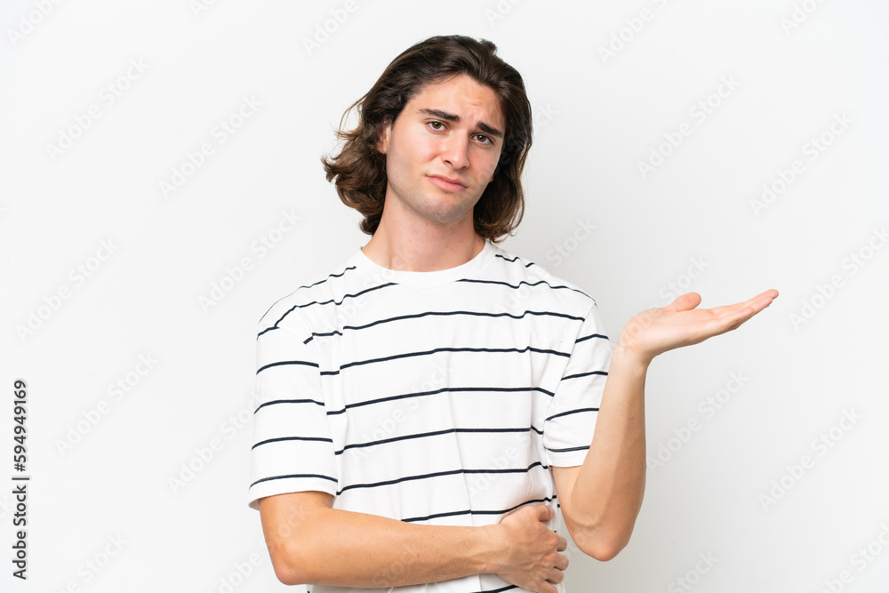 Young handsome man isolated on white background having doubts Young handsome man isolated on white background having doubts