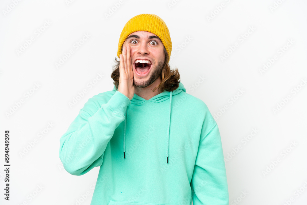 Young handsome man isolated on white chroma background with surprise and shocked facial expression