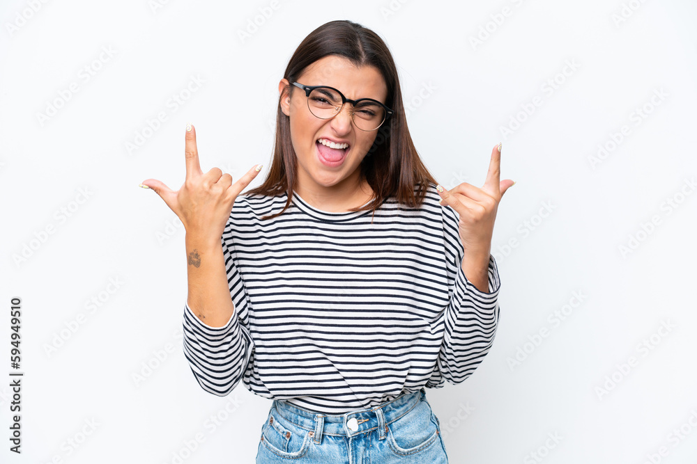 Young caucasian woman isolated on white background making horn gesture Young caucasian woman isolated on white background making horn gesture