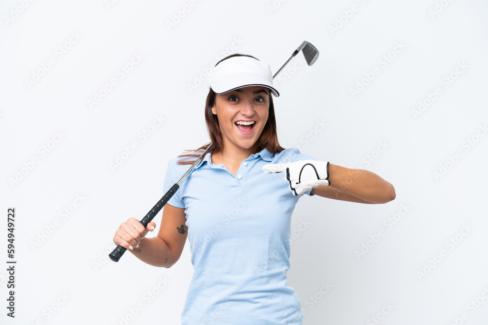 Young caucasian woman playing golf isolated on white background with surprise facial expression Young caucasian woman playing golf isolated on white background with surprise facial expression