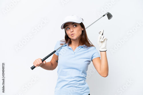 Young caucasian woman playing golf isolated on white background with fingers crossing and wishing the best