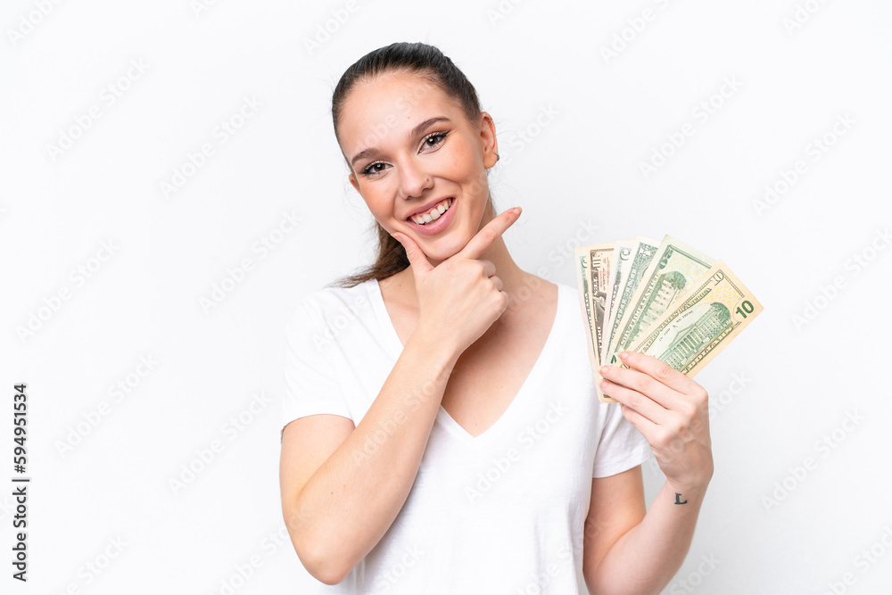 Young caucasian woman taking a lot of money isolated on white background happy and smiling Young caucasian woman taking a lot of money isolated on white background happy and smiling