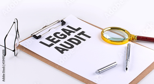 LEGAL AUDIT text on clipboard on white background, business concept