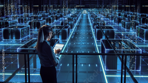 Fotografia Successful Female Data Center IT Specialist Using Tablet Computer, Turning Augmented VFX Visualization on Server Farm Cloud Computing Facility