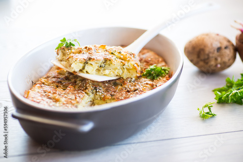 potato casserole with cabbage and spices in a ceramic form