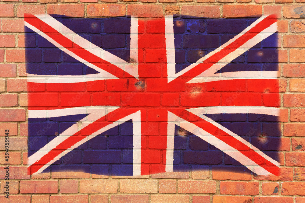 Fototapeta premium The British flag is painted on a brick wall