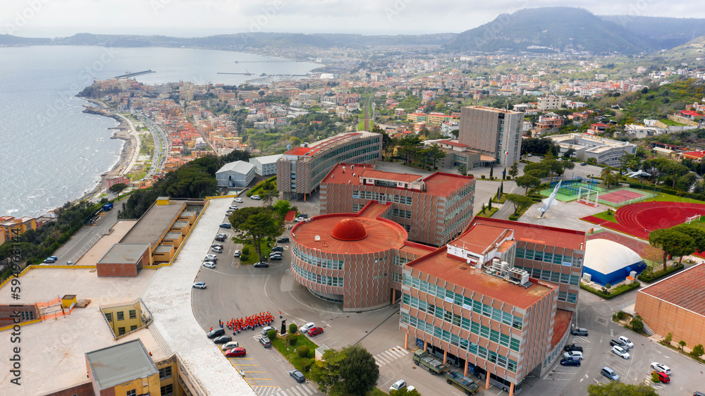 Aerial view of the Italian Air Force Academy in Pozzuoli, near Naples, Italy. It is a military school overlooking the Mediterranean Sea. - obrazy, fototapety, plakaty 