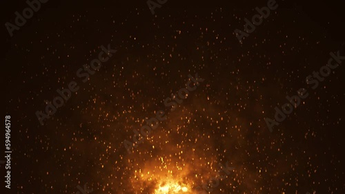 Burning hot bonfire fire sparks on a dark background.