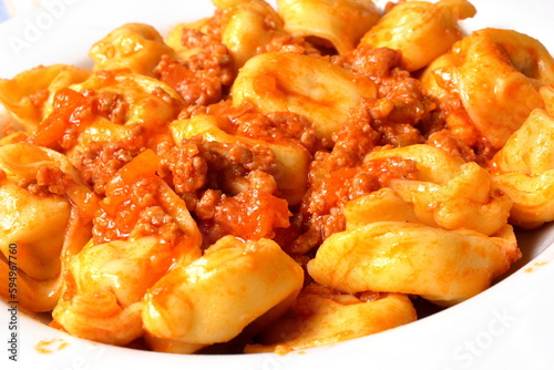 Delicious plate of cappelletti with bolognese sauce.