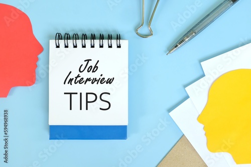 Obraz na płótnie Job interview tips in human resources concept. Office flat lay of blue notepad with written text. w salonie