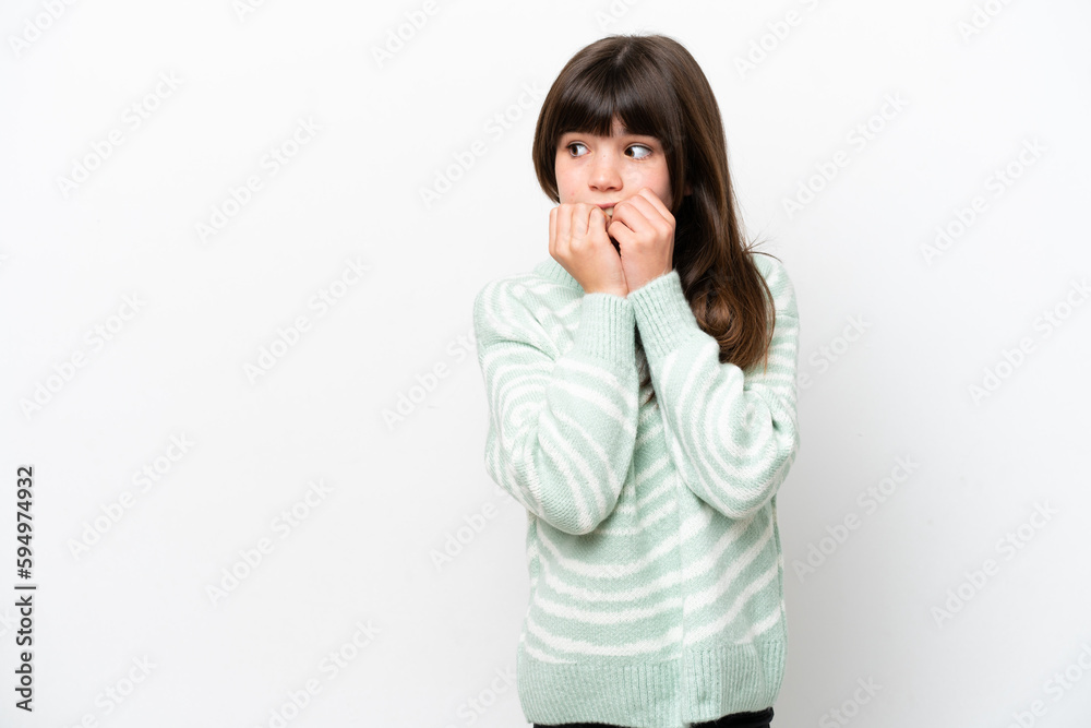Little caucasian girl isolated on white background nervous and scared putting hands to mouth Little caucasian girl isolated on white background nervous and scared putting hands to mouth