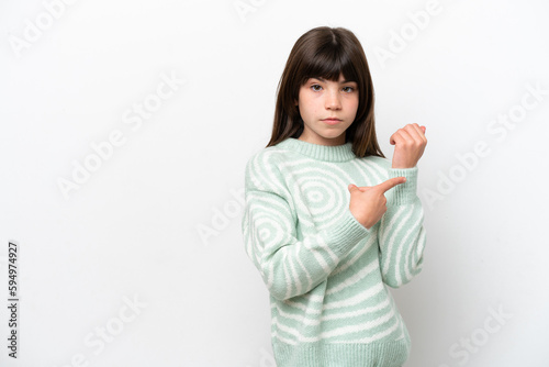 Little caucasian girl isolated on white background making the gesture of being late