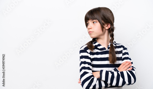 Little caucasian girl isolated on white background keeping the arms crossed