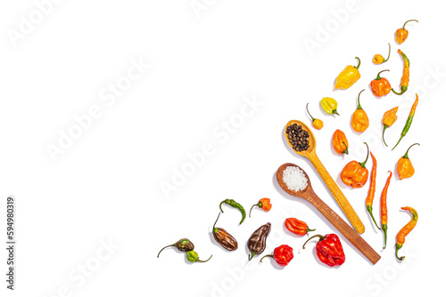 Composition with an assortment of colored peppers isolated on white background. Different varieties