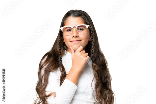 Young girl over isolated chroma key background with glasses and smiling