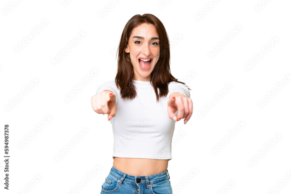 Young caucasian woman over isolated chroma key background surprised and pointing front Young caucasian woman over isolated chroma key background surprised and pointing front