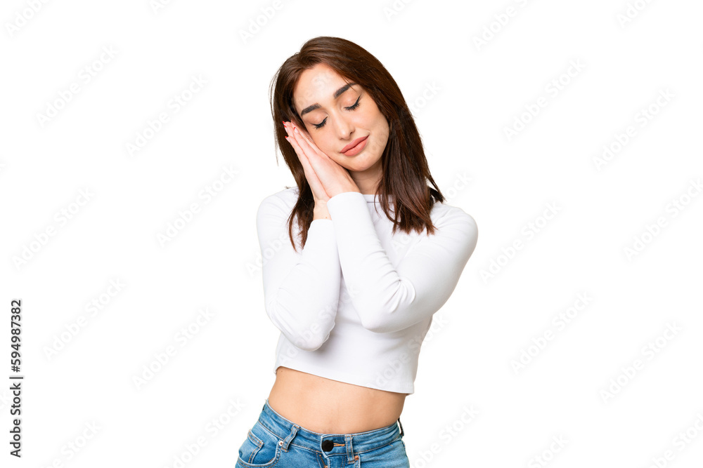 Young caucasian woman over isolated chroma key background making sleep gesture in dorable expression