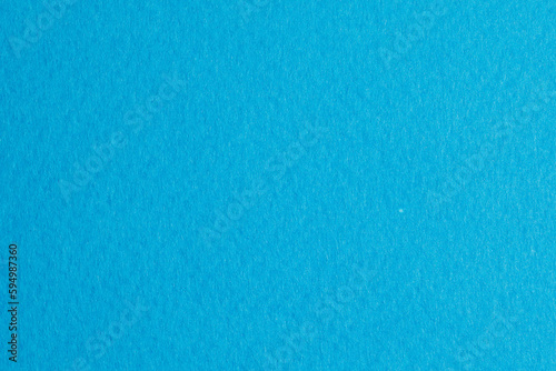 Rough kraft paper pieces background, geometric monochrome paper texture sky blue color. Mockup with copy space for text