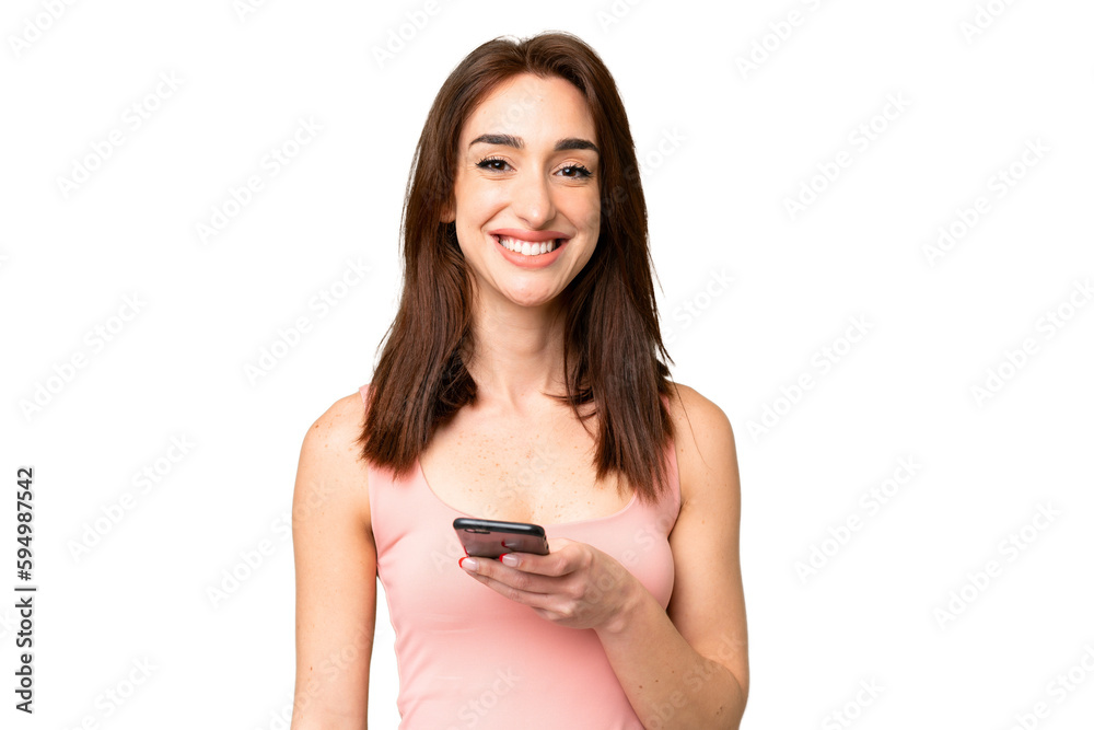 Young caucasian woman over isolated chroma key background using mobile phone Young caucasian woman over isolated chroma key background using mobile phone