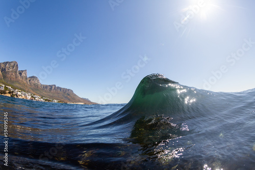 abstract wave breaking on a shallow reef in sunshine