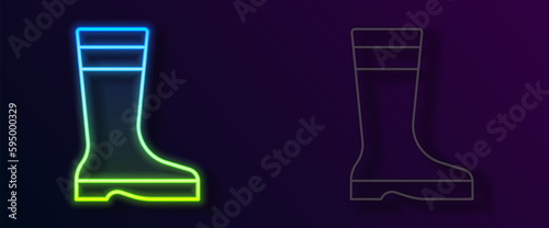 Glowing neon line Fishing boots icon isolated on black background. Waterproof rubber boot. Gumboots for rainy weather, fishing, hunter, gardening. Vector