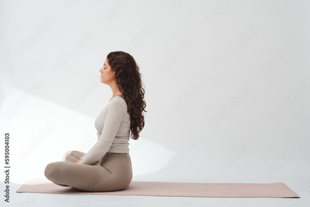 Woman meditating with lotus pose and Namaste hands Woman meditating with lotus pose and Namaste hands