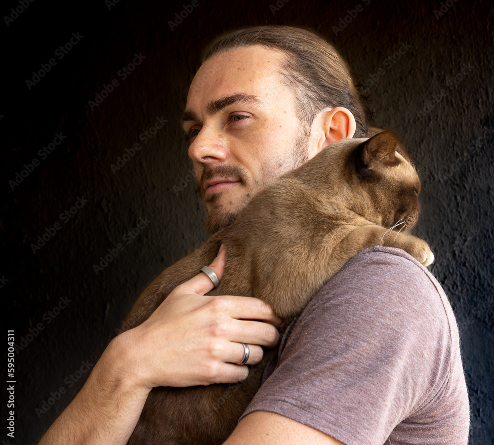 portrait of a person with a Burmese cat