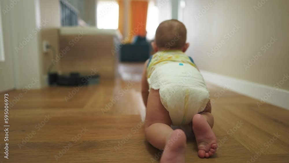 baby newborn crawling on the floor. happy family kindergarten kid ...