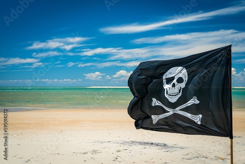 Pirate flag with skull and crossed bones on the background of a tropical beach