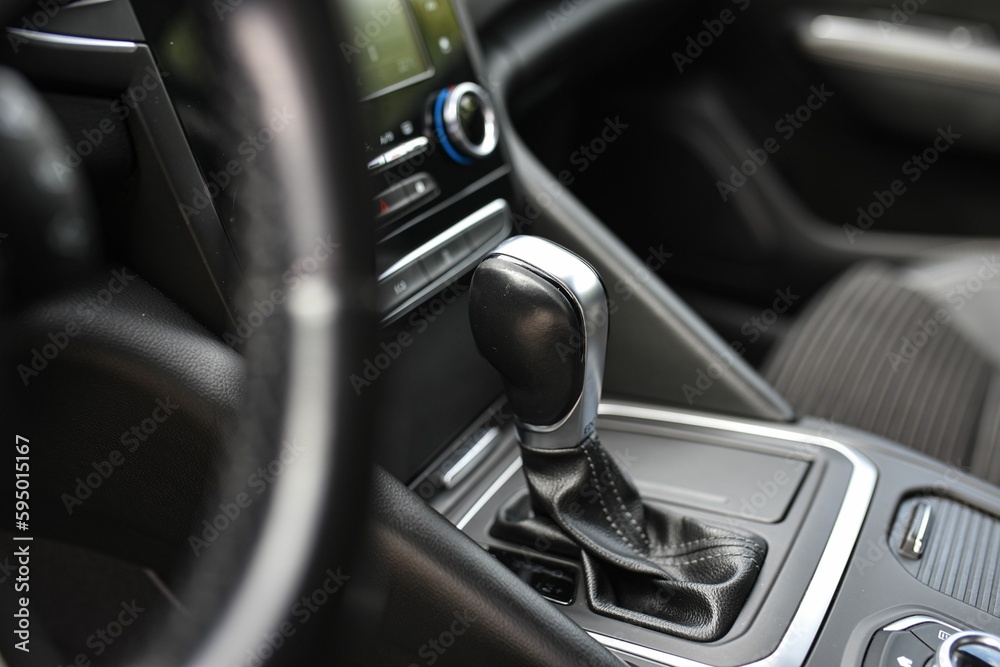 Closeup detail of a car's gear shifter, manual transmission