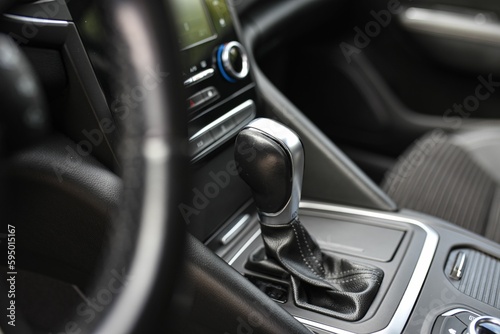 Closeup detail of a car's gear shifter, manual transmission © Stefan Radosavljevic/Wirestock Creators