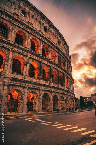 Canvas Print Colosseum illuminated with lights in the evening in Rome, Italy
