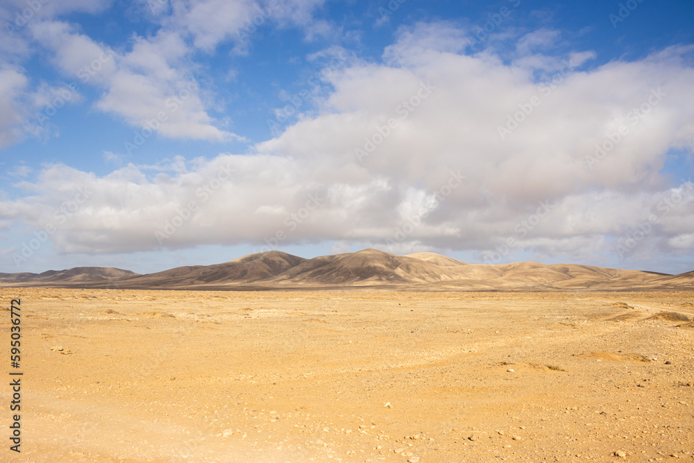 The Majesty of the Desert: Mountains and Sky in the Distance The Majesty of the Desert: Mountains and Sky in the Distance