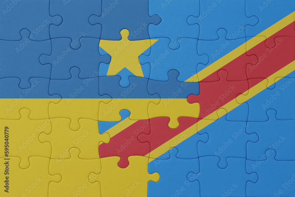 puzzle with the national flag of ukraine and democratic republic of the congo . macro.concept.