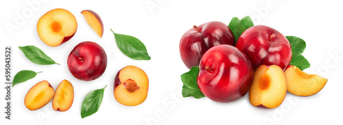 Fototapeta Naklejka Na Ścianę i Meble -  fresh red plum and half with leaves isolated on white background. Top view. Flat lay