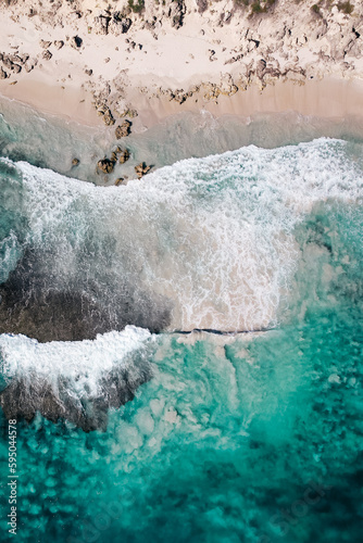 Top down view of waves breaking over the reef at Trigg Beach in Perth, Western Australia photo