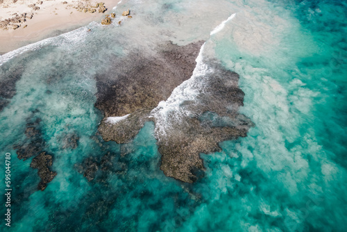 Top down view of waves breaking over the reef at Trigg Beach in Perth, Western Australia photo