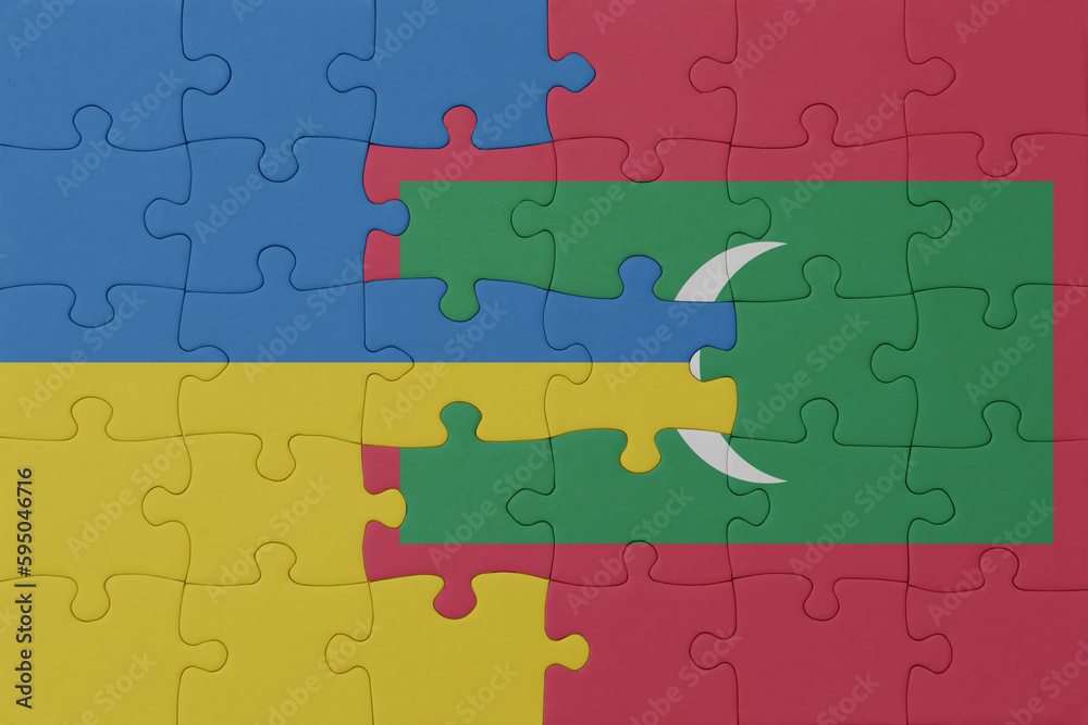 puzzle with the national flag of ukraine and maldives . macro.concept. puzzle with the national flag of ukraine and maldives . macro.concept.