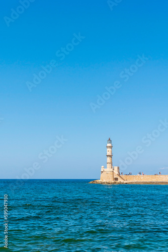 Lighthouse in mediterranean sea. Holidays in Greece