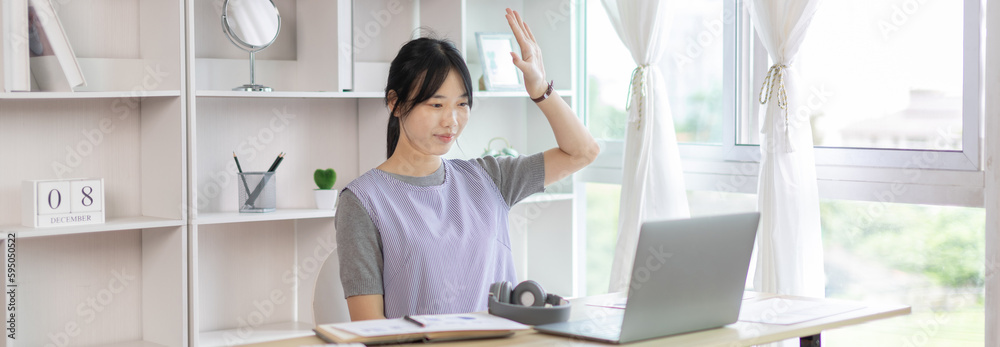 Young Asian women are greeting friends and teachers through video chats and greeting them with cheerful expressions, Online communication , Stay home, New normal, VDO Call, Internet learning.