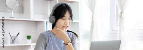 Young Asian women are greeting friends and teachers through video chats and greeting them with cheerful expressions, Online communication , Stay home, New normal, VDO Call, Internet learning.