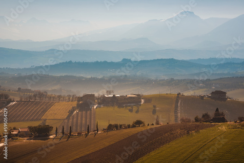 Countryside landscape in autumn, agricultural fields among hills