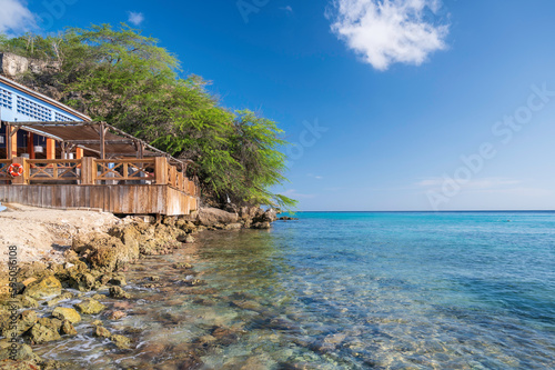 A wooden structure, overlooking the clear, Caribbean ocean, at Kokomo Beach, Curacao, Dutch Antilles
