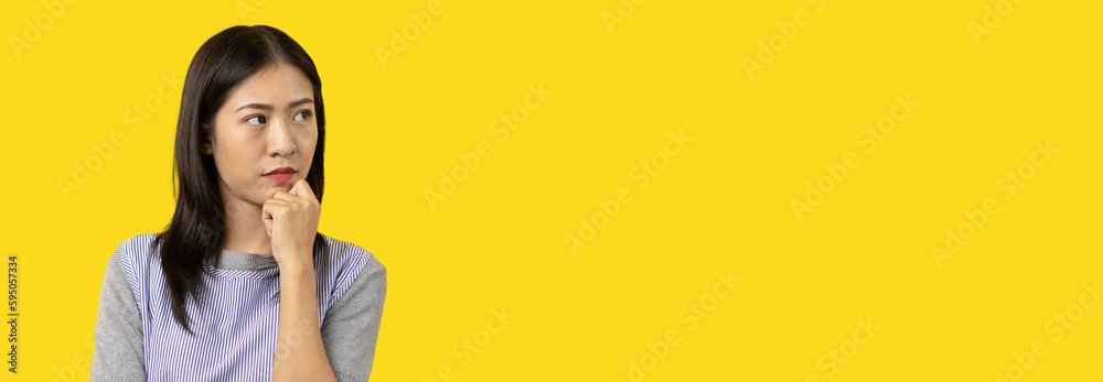 Φωτογραφία Young Asian woman thinking hard or planning to do something, Overthinking or worrying, Have a headache, Migraine, Stress, Free space for advertising or promoting products, Copy space, Enter text
