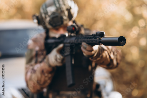 Military, war, conflict, soldiers - Special forces soldier man hold Machine gun. Military equipment NATO soldiers