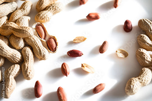 Peanuts in shell isolated on white background. Heap of peanuts close up