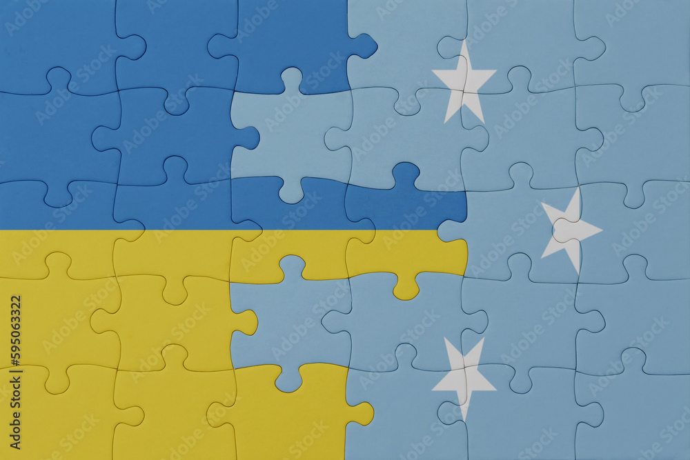 puzzle with the national flag of ukraine and Federated States of Micronesia . macro.concept.