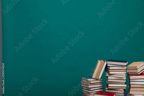 stack of books on a green background in the learning library