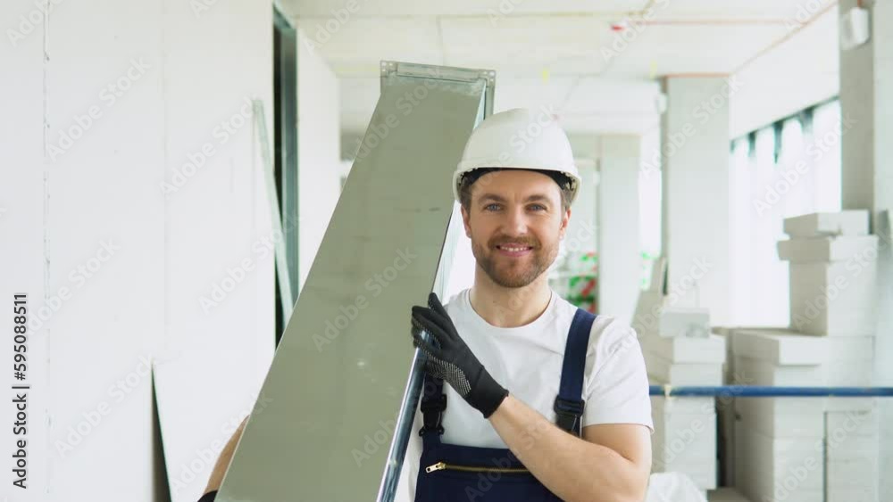 Portrait of positive hvac worker with ventilation pipe on construction site Portrait of positive hvac worker with ventilation pipe on construction site